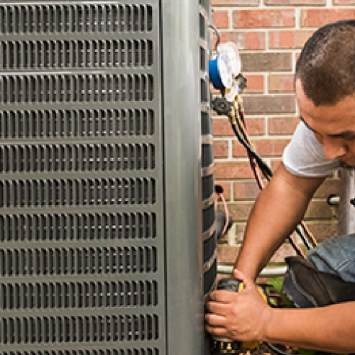 HVAC Technician Servicing AC Furnace System in Dayton, Ohio